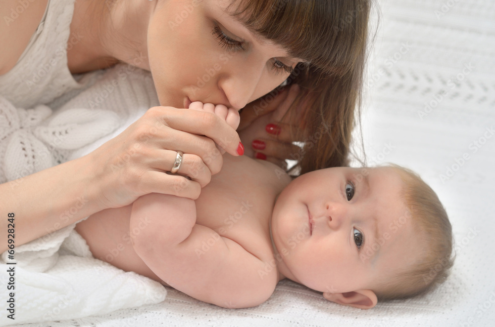 mother kissing baby hand mother kissing baby hand