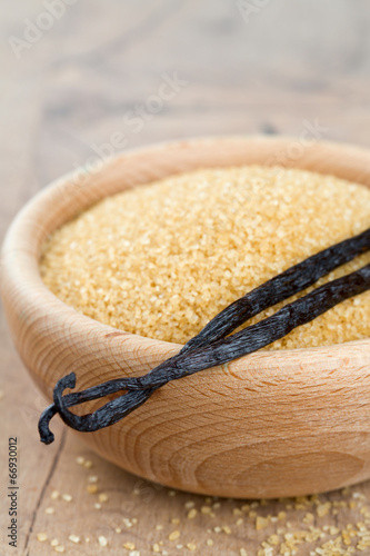 vanilla pods and brown cane sugar in a bowl