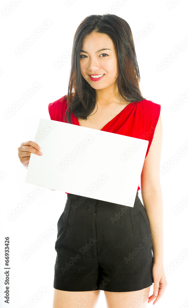 Saleswoman holding a blank placard and smiling Saleswoman holding a blank placard and smiling