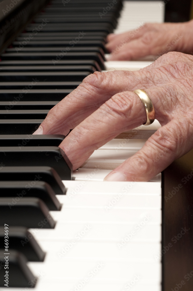 Fototapeta premium Hands on a Piano