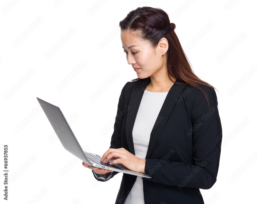 Asian business woman look at laptop computer