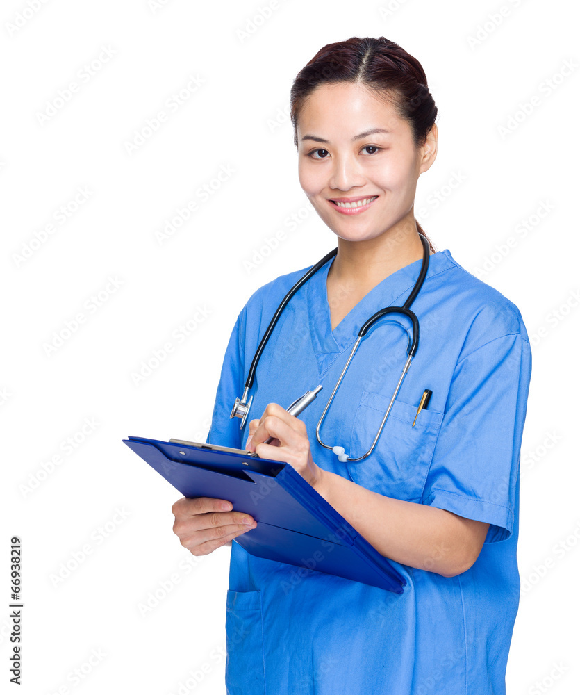 Female medical doctor write on clipboard Female medical doctor write on clipboard