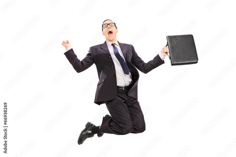 Businessman with briefcase jumping out of joy Businessman with briefcase jumping out of joy