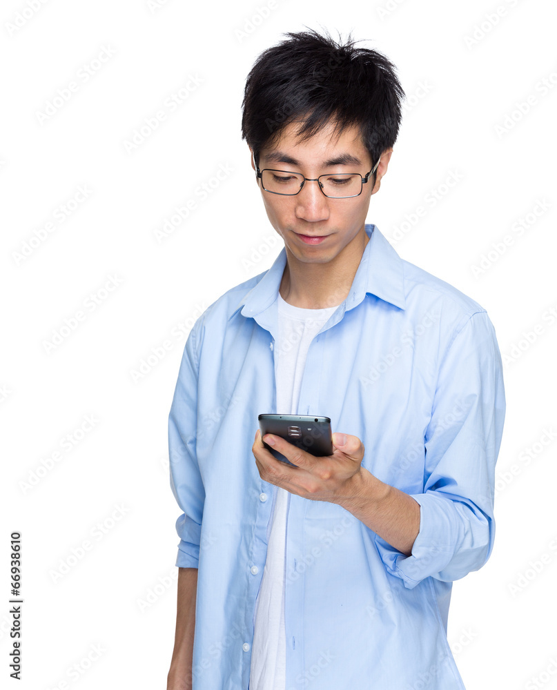 Asian man read text message on mobile phone Asian man read text message on mobile phone