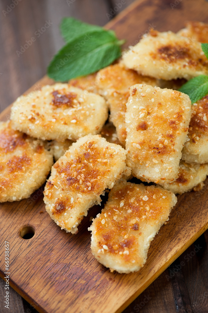 Sesame chicken nuggets, high angle view, vertical shot Sesame chicken nuggets, high angle view, vertical shot