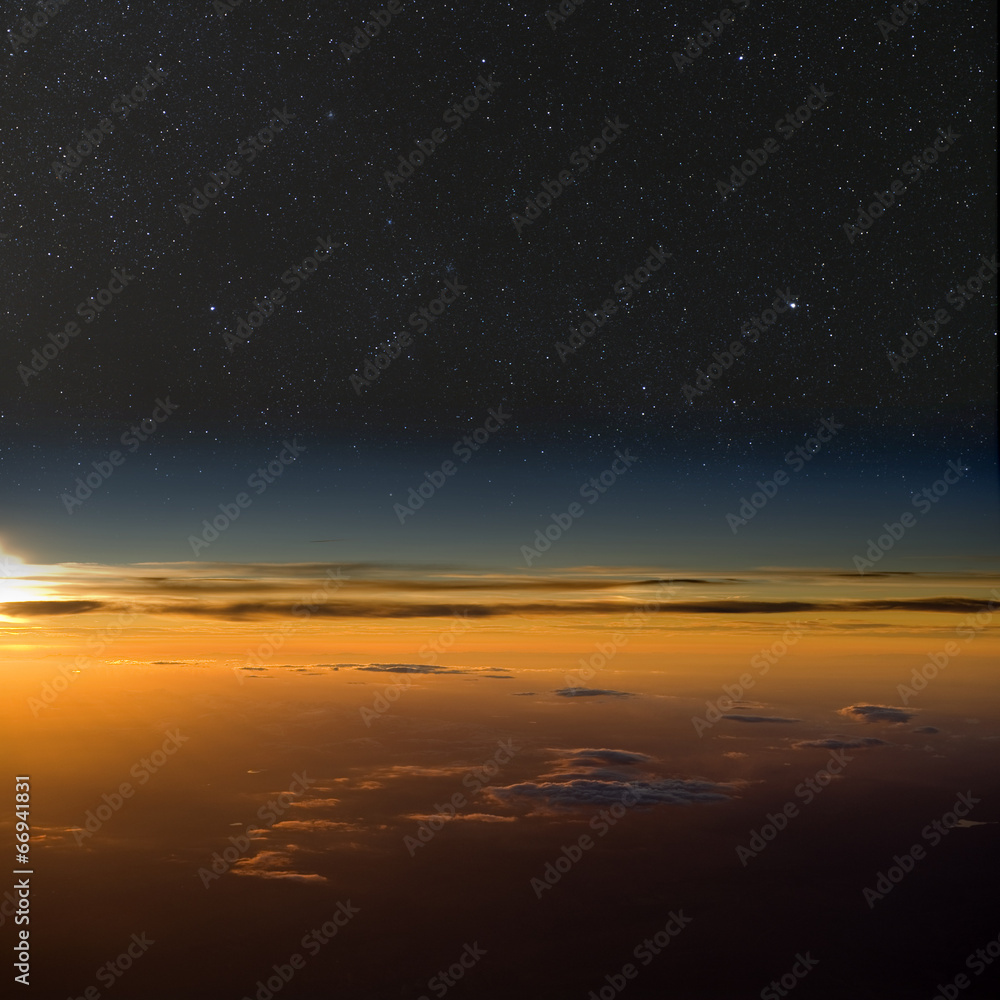 High altitude sunset. Stars above clouds below. High altitude sunset. Stars above clouds below.
