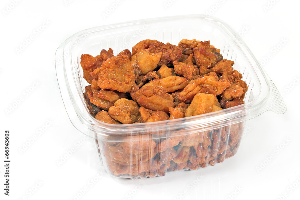 Pork greaves in plastic bowl isolated on white Pork greaves in plastic bowl isolated on white