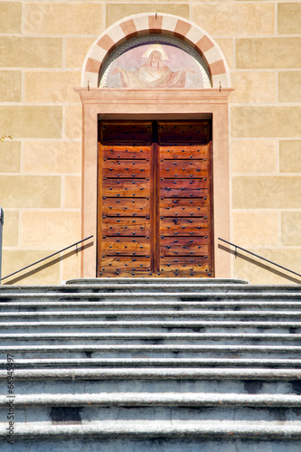 church  tradate varese italy   old door entrance and mosaic photo