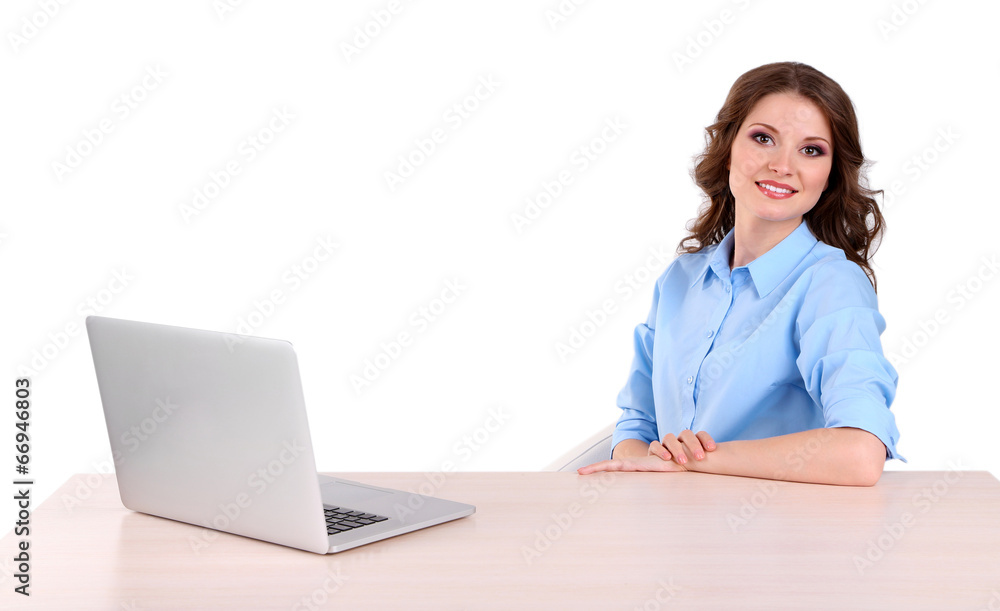 Young business woman sitting at table with notebook in room Young business woman sitting at table with notebook in room