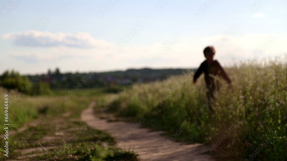 Boy with a girl playing on the meadow. Boy with a girl playing on the meadow.
