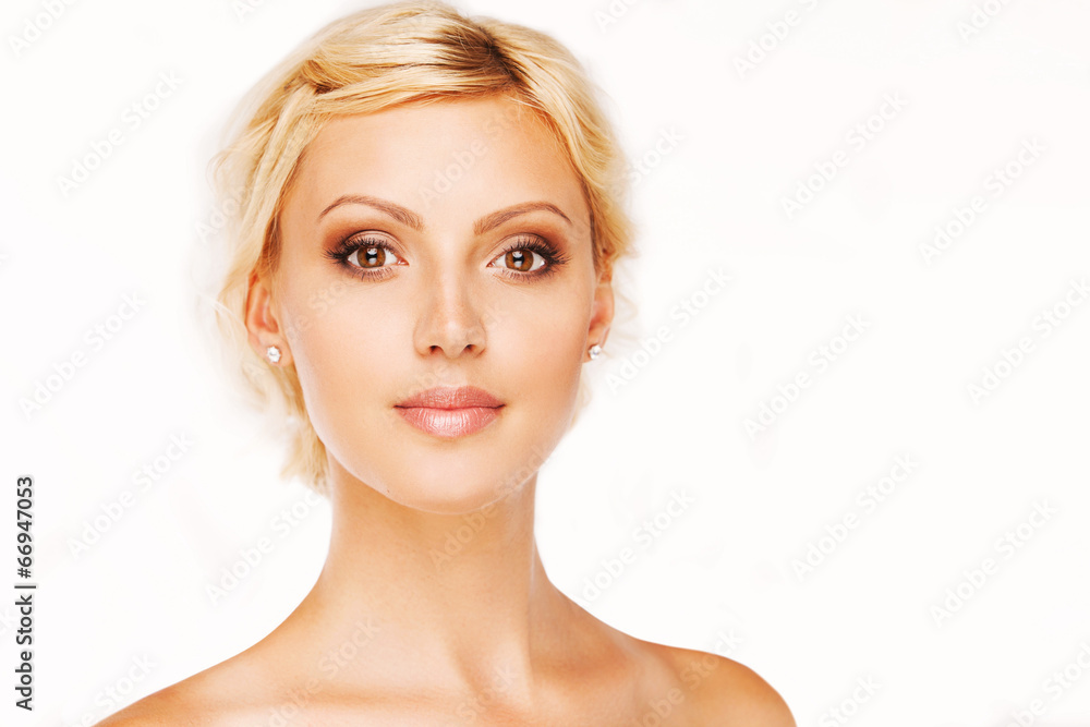 Fototapeta premium Portrait of beautiful woman with perfect skin and face on white
