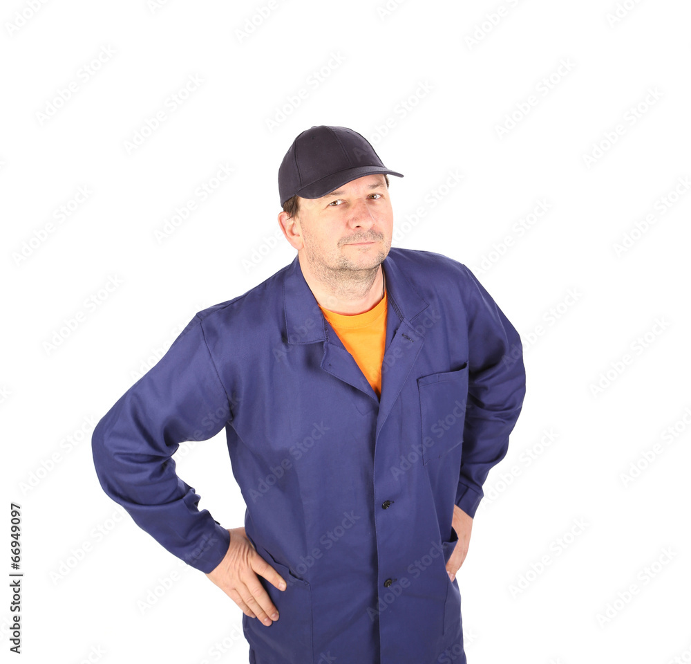 Worker in uniform and black cap. Worker in uniform and black cap.
