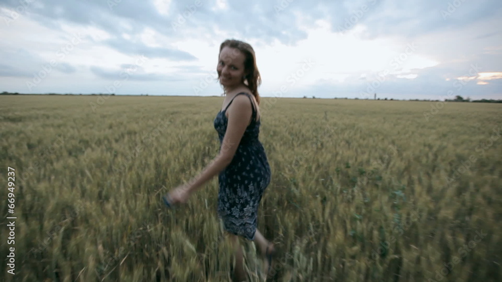 Beautiful girl in dark dress enjoy life in wide field Beautiful girl in dark dress enjoy life in wide field