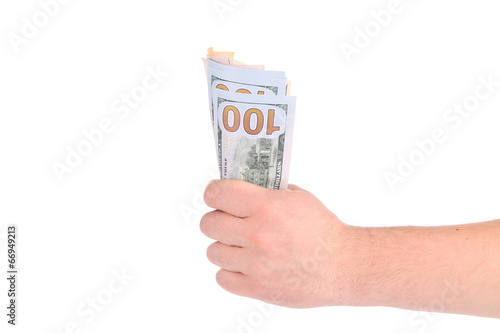 Hand holding hundred dollar bills.