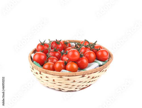 Fresh red tomatoes in a basket.