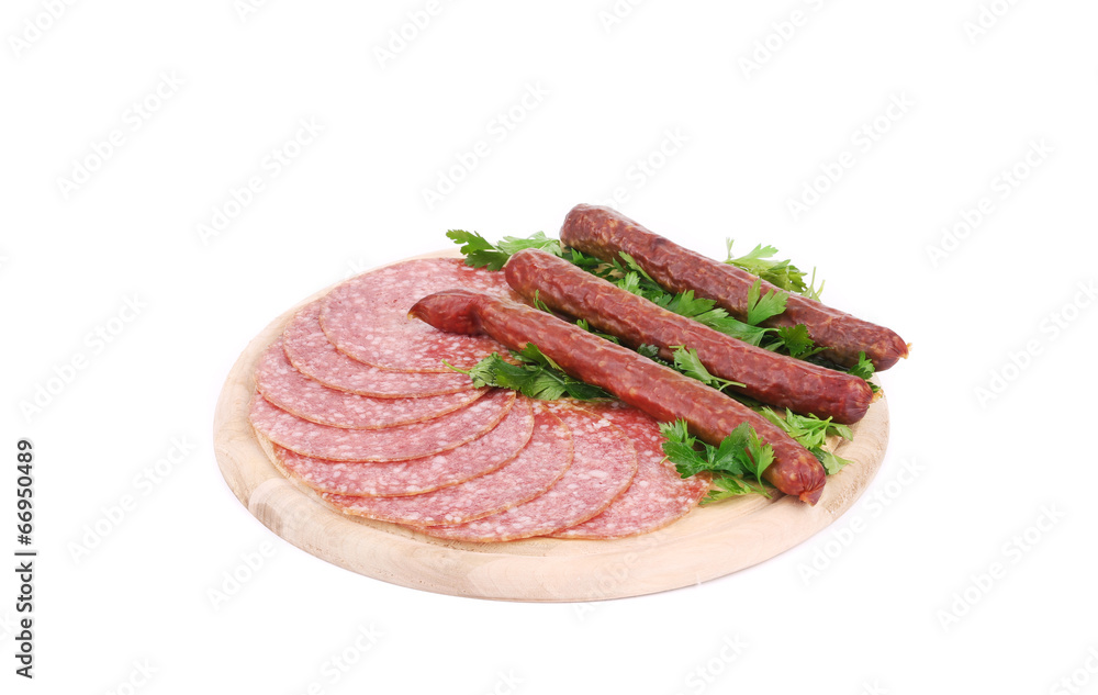 Composition of sausages on wooden platter. Composition of sausages on wooden platter.