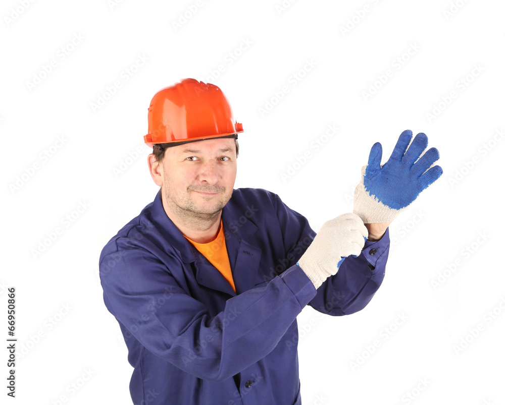 Worker putting on glove. Worker putting on glove.