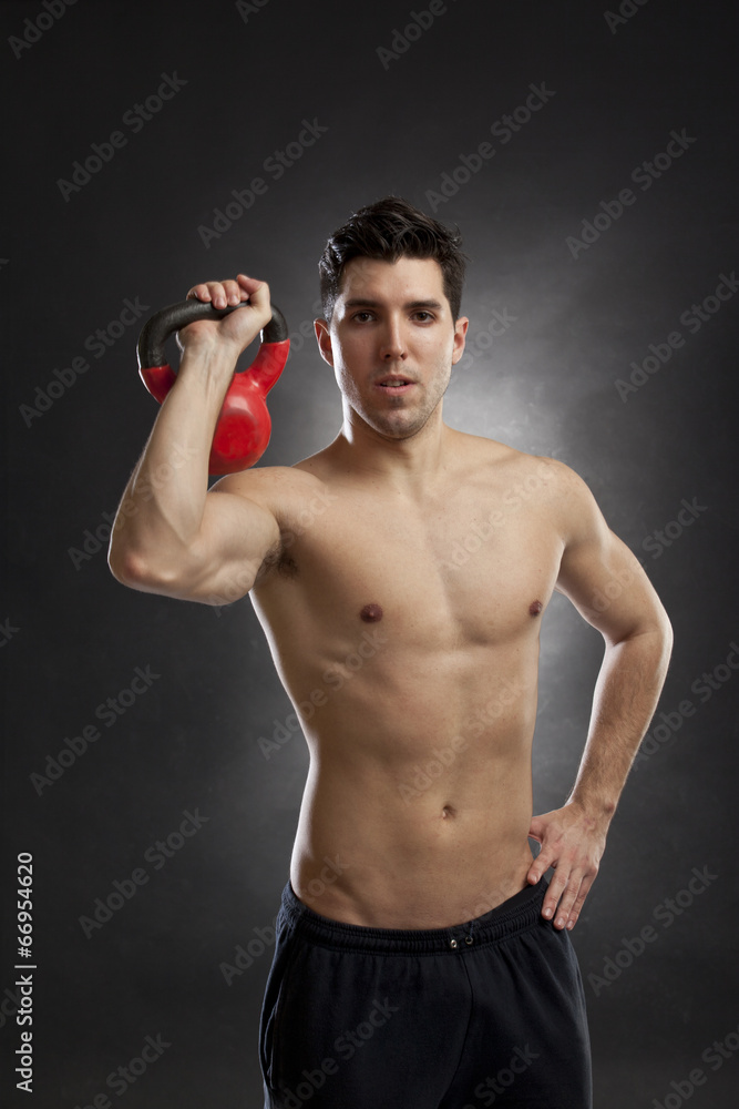 man doing exercises with kettlebell