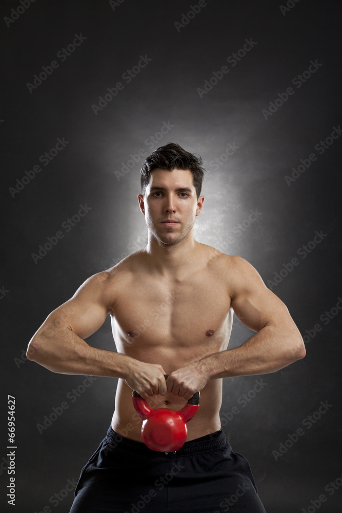 man doing exercises with kettlebell