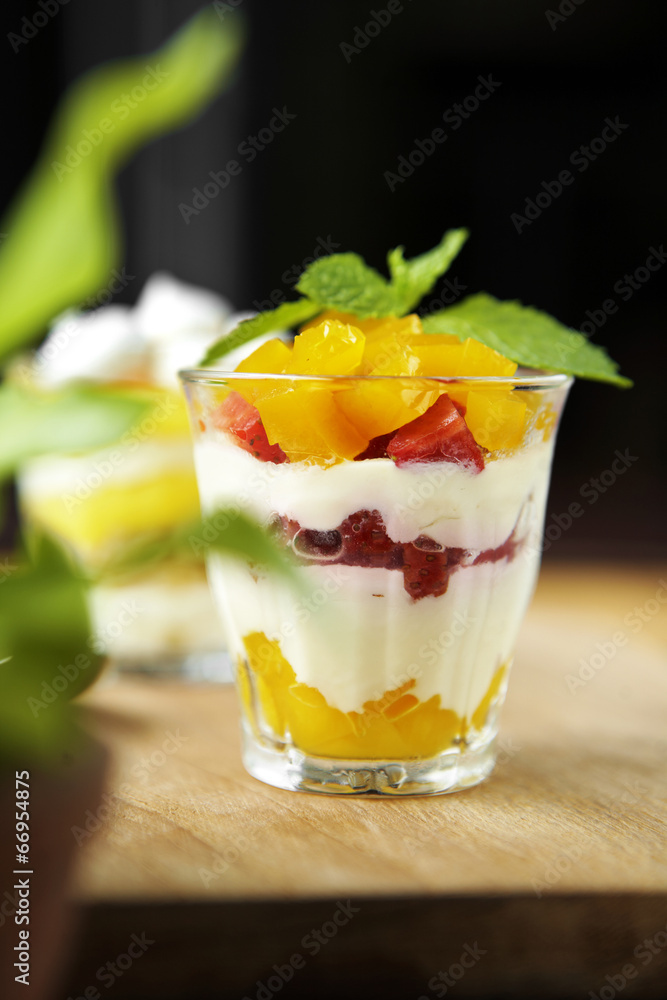 close up strawberry and mango pudding in cup close up strawberry and mango pudding in cup