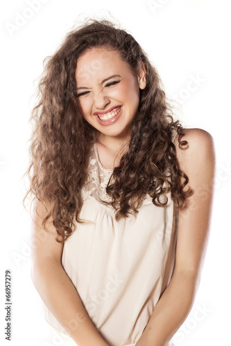 very happy young girl on white background © vladimirfloyd