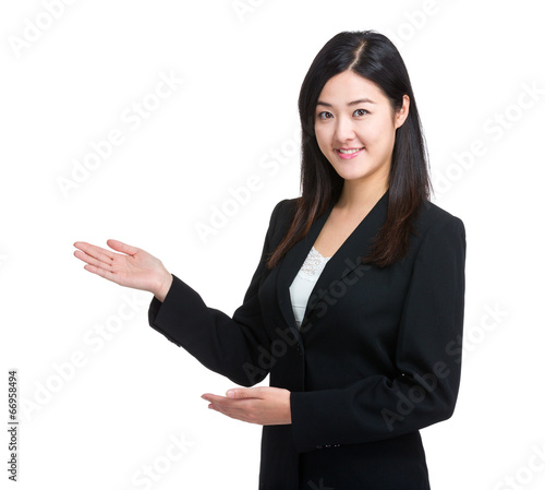 Business woman introduce something by hand