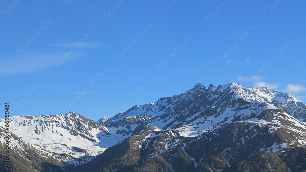 rocky mountains and snow and blue sky