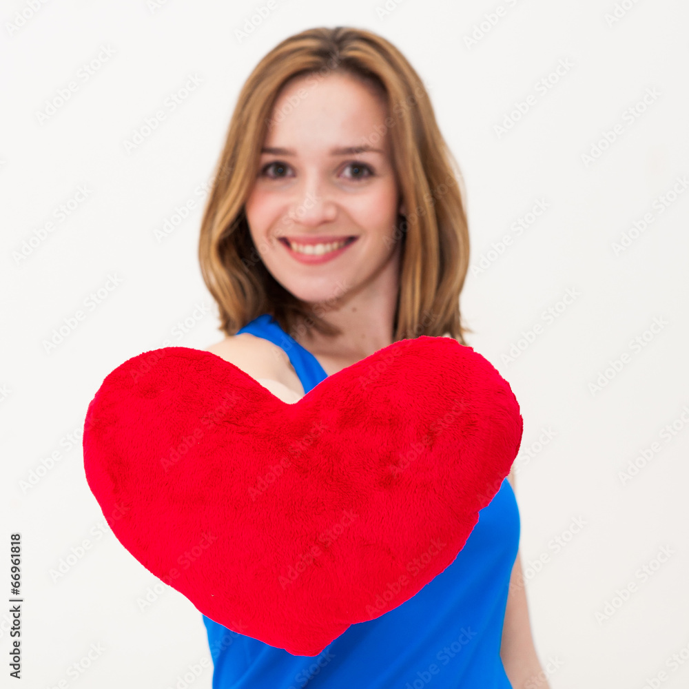 young woman holding a red heart young woman holding a red heart
