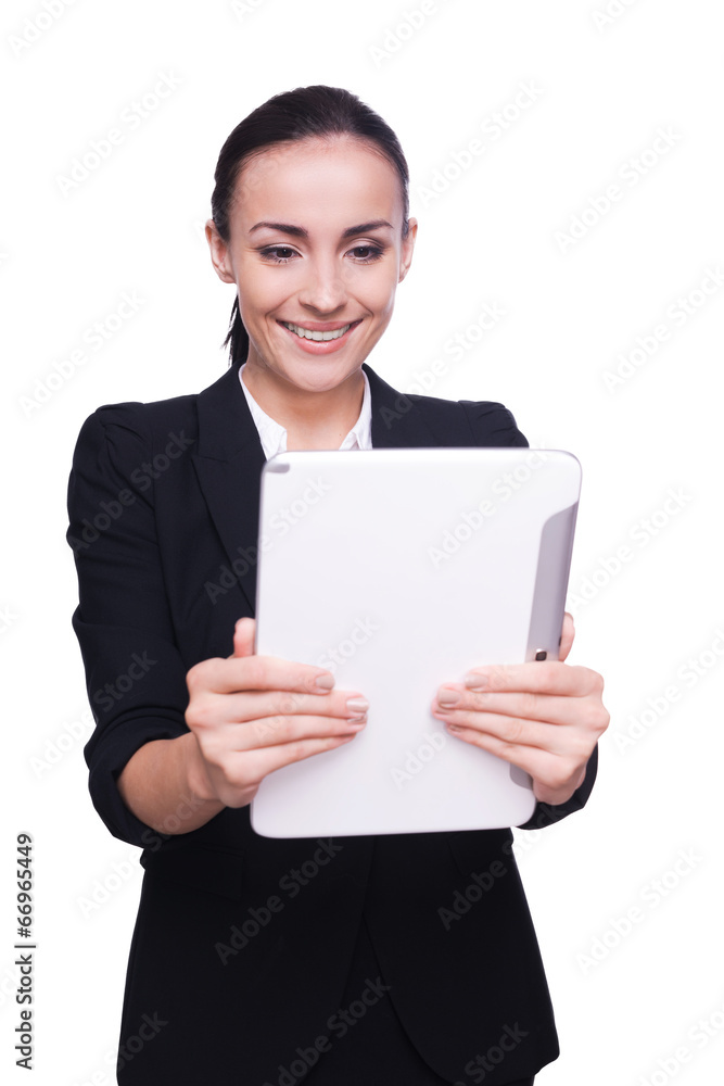 Examining her brand new tablet. Examining her brand new tablet.