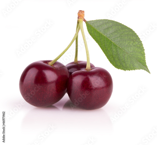 three ripe cherries