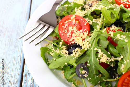 Fresh salad with arugula, close up