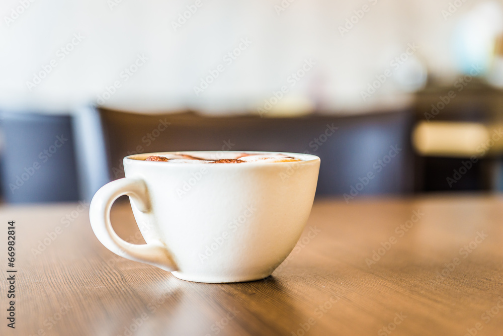 Coffee cup in coffee shop interior