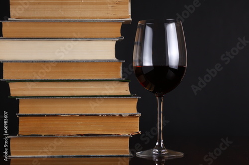 Wine glass and books