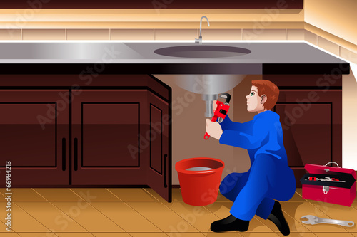 Plumber fixing a leaky faucet