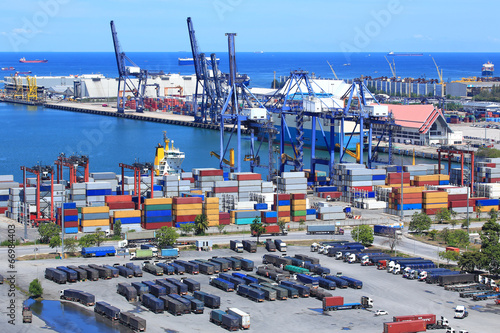 Industrial Container Cargo freight ship with working crane bridg