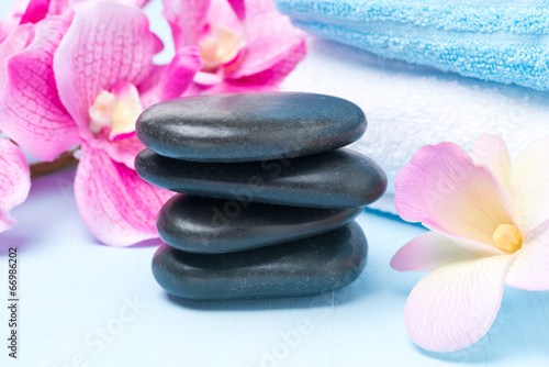 Spa stones, flowers and towels, selective focus