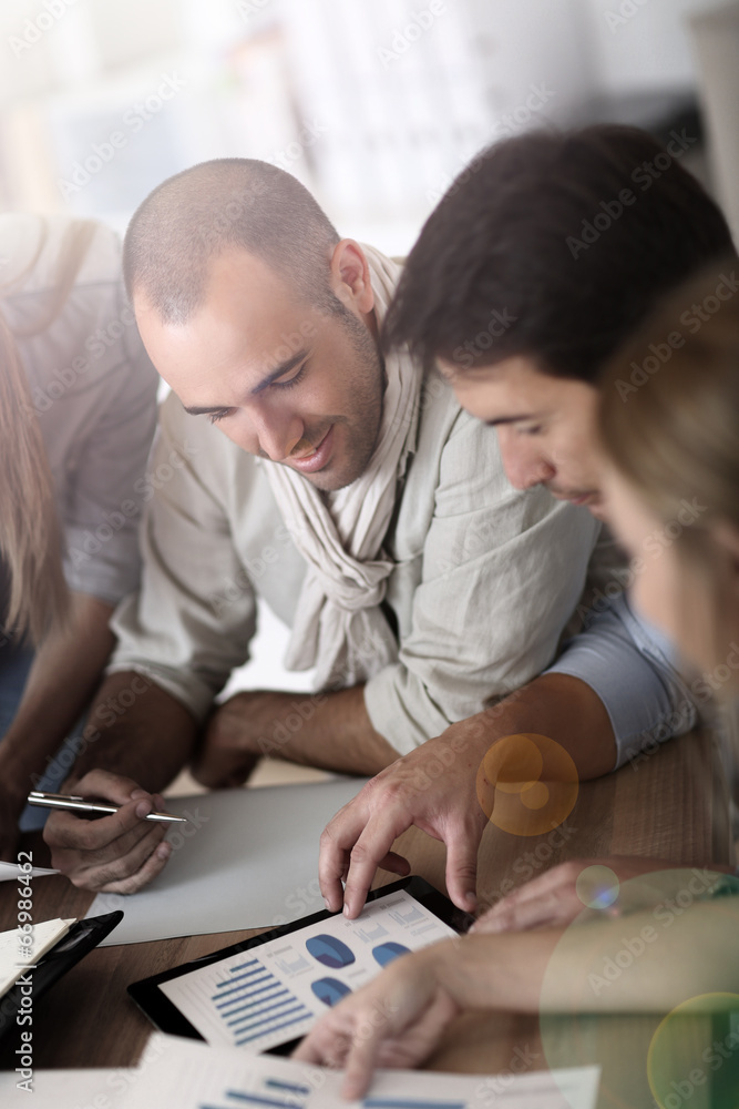 Business team working on marketing plan Business team working on marketing plan