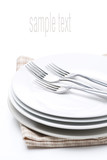 tableware for dinner - plates and forks, isolated on white