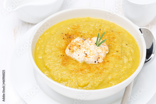 vegetable soup with cream and rosemary, top view