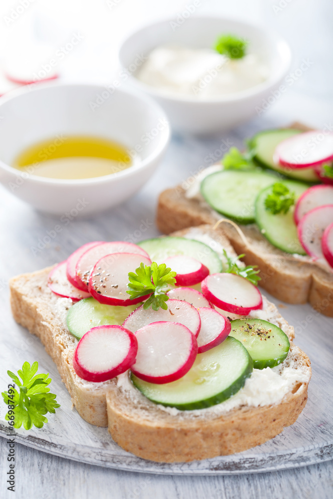 healthy sandwich with radish cucumber and cream cheese