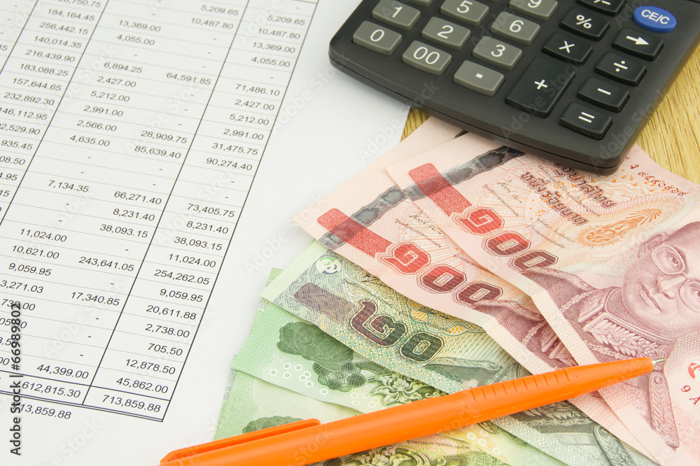 Bill on finance account with pen and calculator Bill on finance account with pen and calculator
