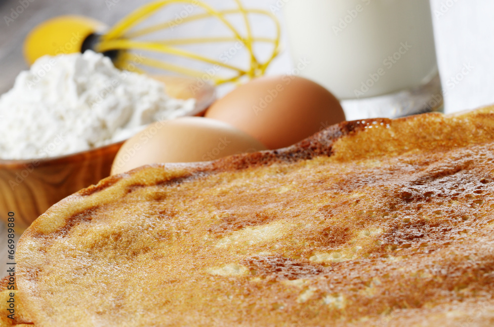 Milk, flour, whisk, pancakes and eggs Milk, flour, whisk, pancakes and eggs