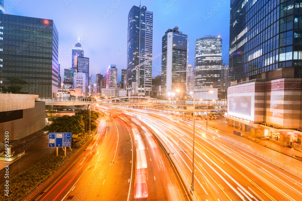 traffic with blur light through city at night