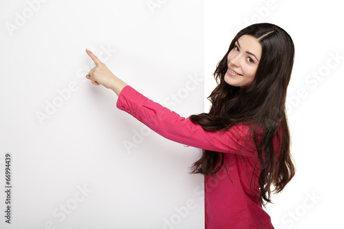 Young smile woman pointing at a blank board