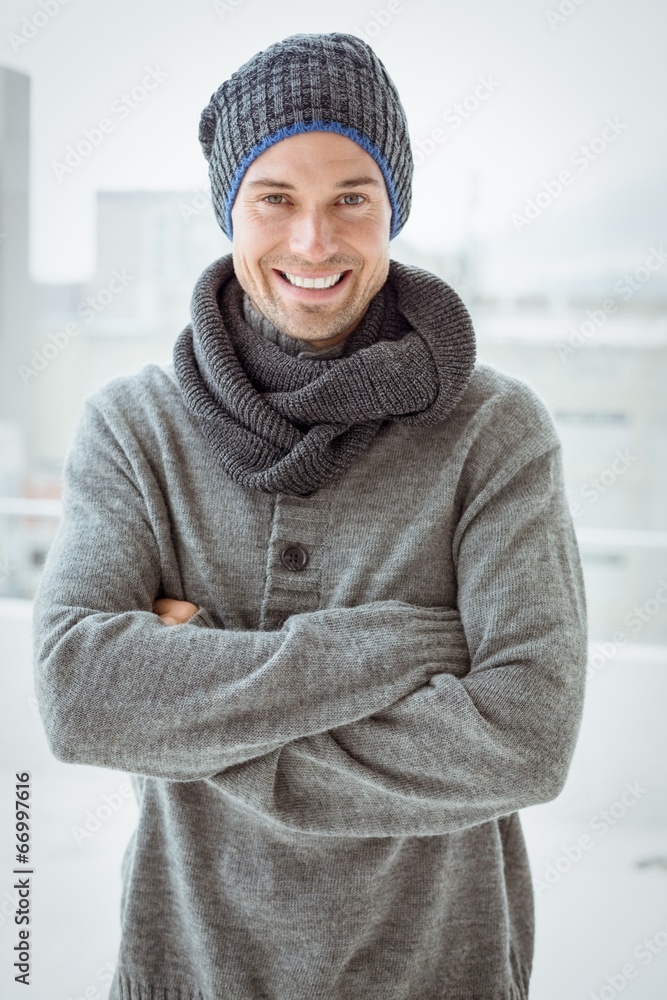 Handsome man in warm clothing smiling at camera Handsome man in warm clothing smiling at camera