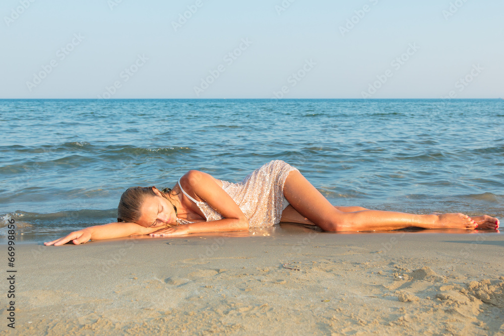 young sexy girl in bikini and wet shirt at the beach young sexy girl in bikini and wet shirt at the beach