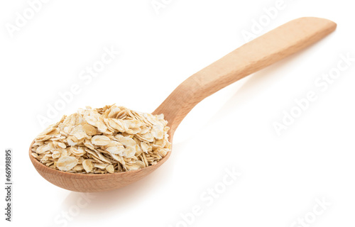 oat flakes in spoon on white