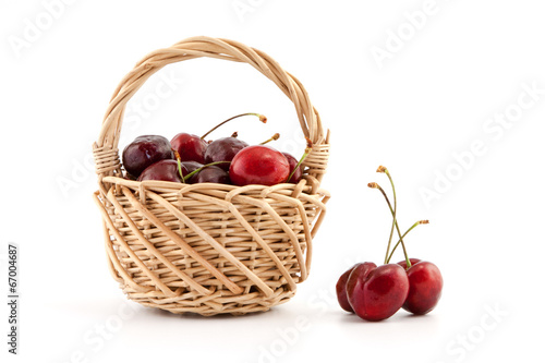 Basket with red ripe cherries