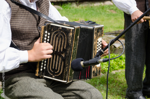 Accordionist man play folk music with accordion