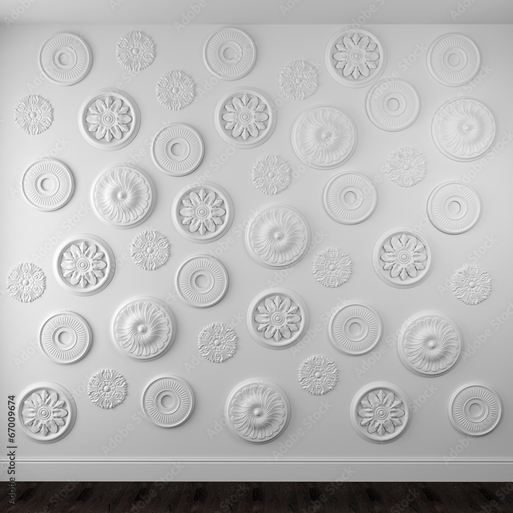 Beautiful rosettes on a white wall Beautiful rosettes on a white wall